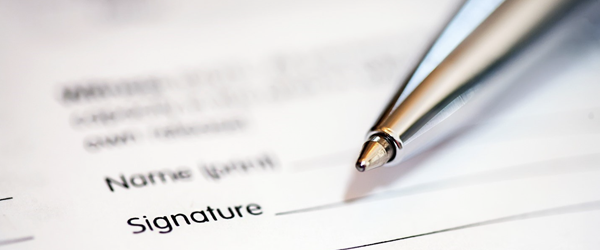 Pen placed on top of a signature line