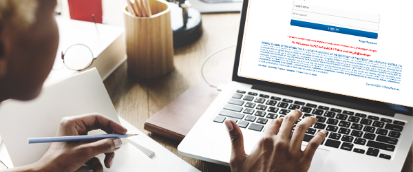 Photo of woman typing on a laptop