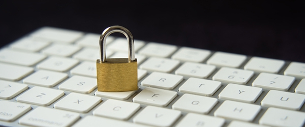 Photo of padlock on top of a keyboard