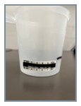 Photo of collection cup showing temperature of specimen.